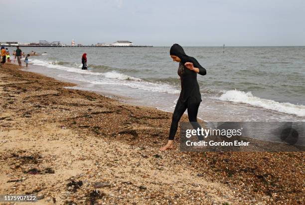burkini on the beach, uk. - burkini bildbanksfoton och bilder