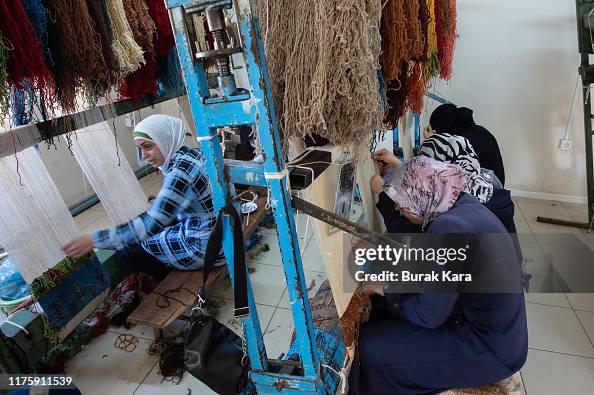 Syria Workshops Syrian refugee women attend a carpet making workshop at the... News ...
