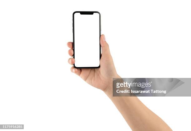 close up hand hold phone isolated on white, mock-up smartphone white color blank screen - phone hand stock-fotos und bilder