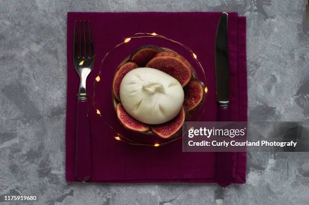 burrata cheese (italian) with figs. new year or saint valentines day decoration - büffelmozzarella stock-fotos und bilder