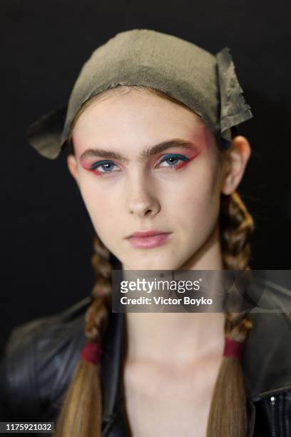 Model prepares backstage for Antonio Marras fashion show during the Milan Fashion Week Spring/Summer 2020 on September 20, 2019 in Milan, Italy.