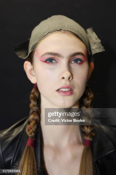 Model prepares backstage for Antonio Marras fashion show during the Milan Fashion Week Spring/Summer 2020 on September 20, 2019 in Milan, Italy.