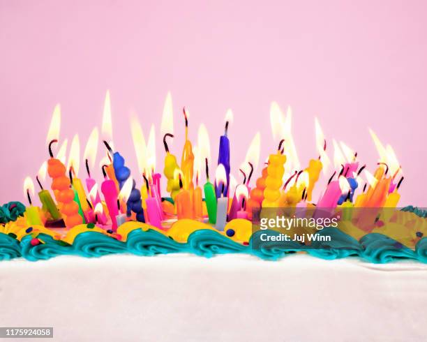 birthday candles on a cake - birthday cake stock pictures, royalty-free photos & images