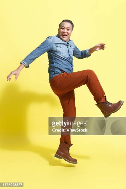 a happy old man - jumping casual clothing studio shot stock pictures, royalty-free photos & images