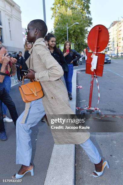 Adut Akech arrives before Versace show during the Milan Fashion Week Spring/Summer 2020 on September 20, 2019 in Milan, Italy.