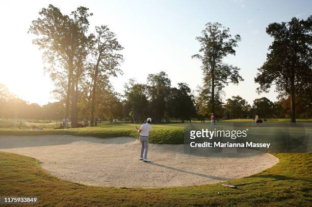 Poston of the United States plays his shot out of the bunker on the 11th hole during a continuation of the first round of the Sanderson Farms...