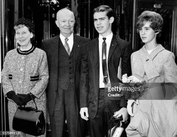 Picture taken on August 16, 1962 at London showing American General Dwight D. Eisenhower with his wife Mamie , his Grandson Dwight David and his...