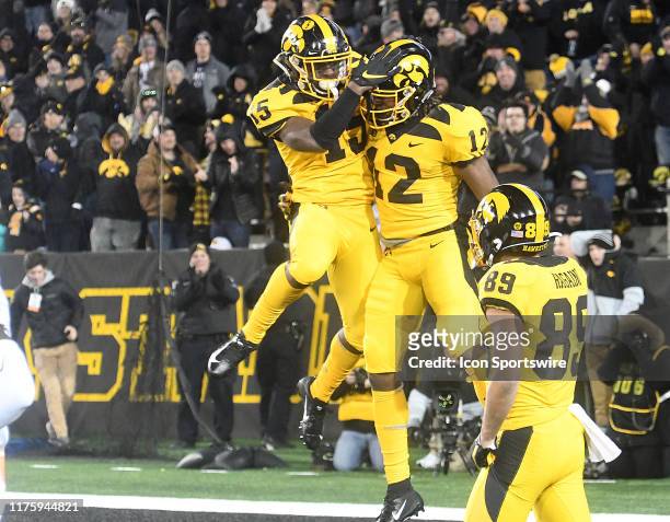 Iowa Hawkeyes running back Tyler Goodson celebrates with Iowa Hawkeyes split end Brandon Smith after a touchdown late in the game during a Big Ten...