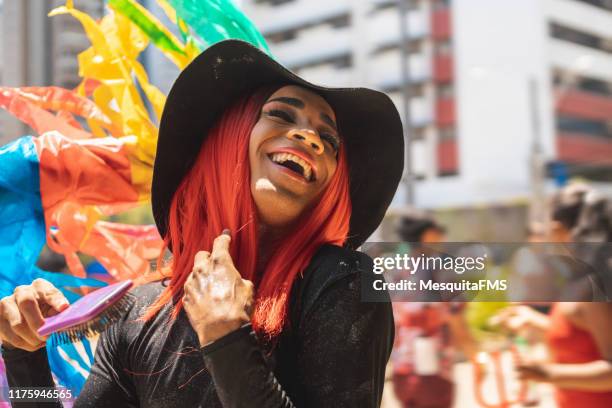 afro drag queen laughing out loud at the outdoor lgbt parade - black transvestite stock pictures, royalty-free photos & images