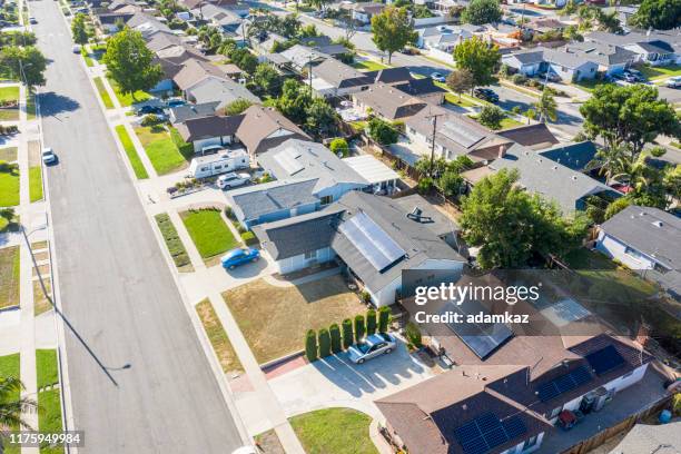 aerial neighborhood with solar panels - solar panel home stock pictures, royalty-free photos & images