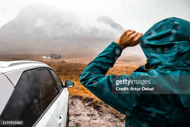 adventure off road with car in the scottish highlands with rain. - scotland weather stock pictures, royalty-free photos & images