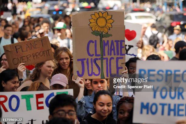 People march as they take part in a strike to demand action on the global climate crisis on September 20, 2019 in New York City. In what could be the...