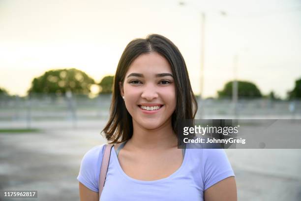outdoor portrait of smiling female hispanic teenager - girl 18 stock pictures, royalty-free photos & images