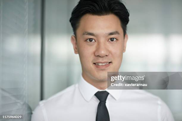 headshot of middle aged chinese businessman in shirt and tie - shirt and tie stock pictures, royalty-free photos & images