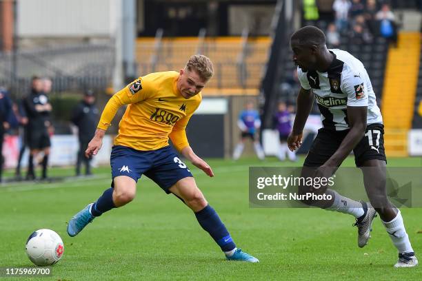 Ben Whitfield of Torquay United battles with Zoumana Bakayogo of Notts County during the Vanarama National League match between Notts County and...