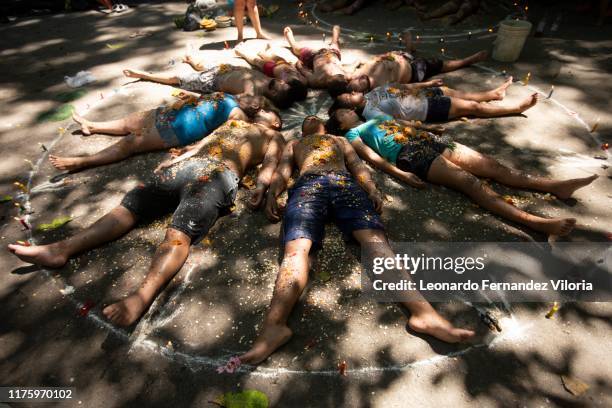 People participates in a prosperity ritual called "Velación" during a meeting of people following the cult of María Lionza on the mountain of Sorte...