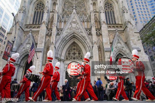 The Sacred Heart University marching band marches past St. Patrick's Cathedral on Fifth Avenue during the 75th annual Columbus Day Parade in Midtown...