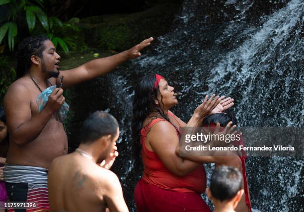 Man who is trance by a spirit of a viking warrior is helped by your spiritual guide during a spiritual ritual inside the "well of the mediums" in the...