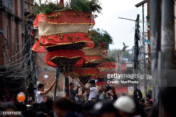 Locals carry as well as rotates top part of a chariot of Lord Narayan across the streets of Hadigaun during Lord Narayan jatra festival in Hadigaun,...