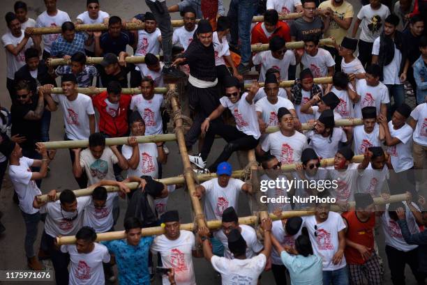 Locals carrying a chariot of Lord Narayan across the streets of Hadigaun during Lord Narayan jatra festival in Hadigaun, Kathmandu, Nepal on Monday,...