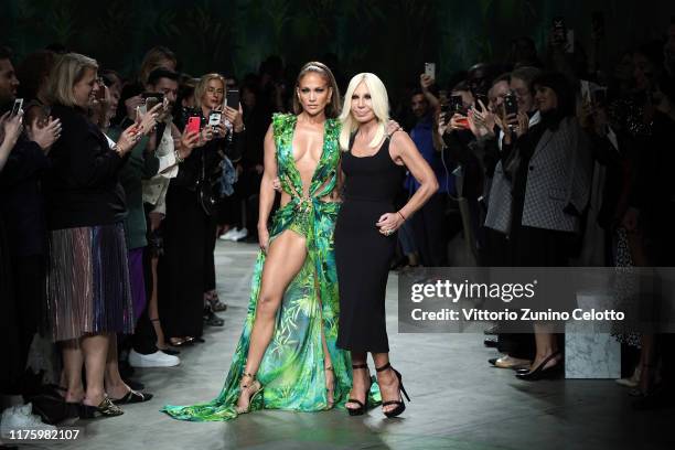 Jennifer Lopez and Donatella Versace walk the runway at the Versace show during the Milan Fashion Week Spring/Summer 2020 on September 20, 2019 in...