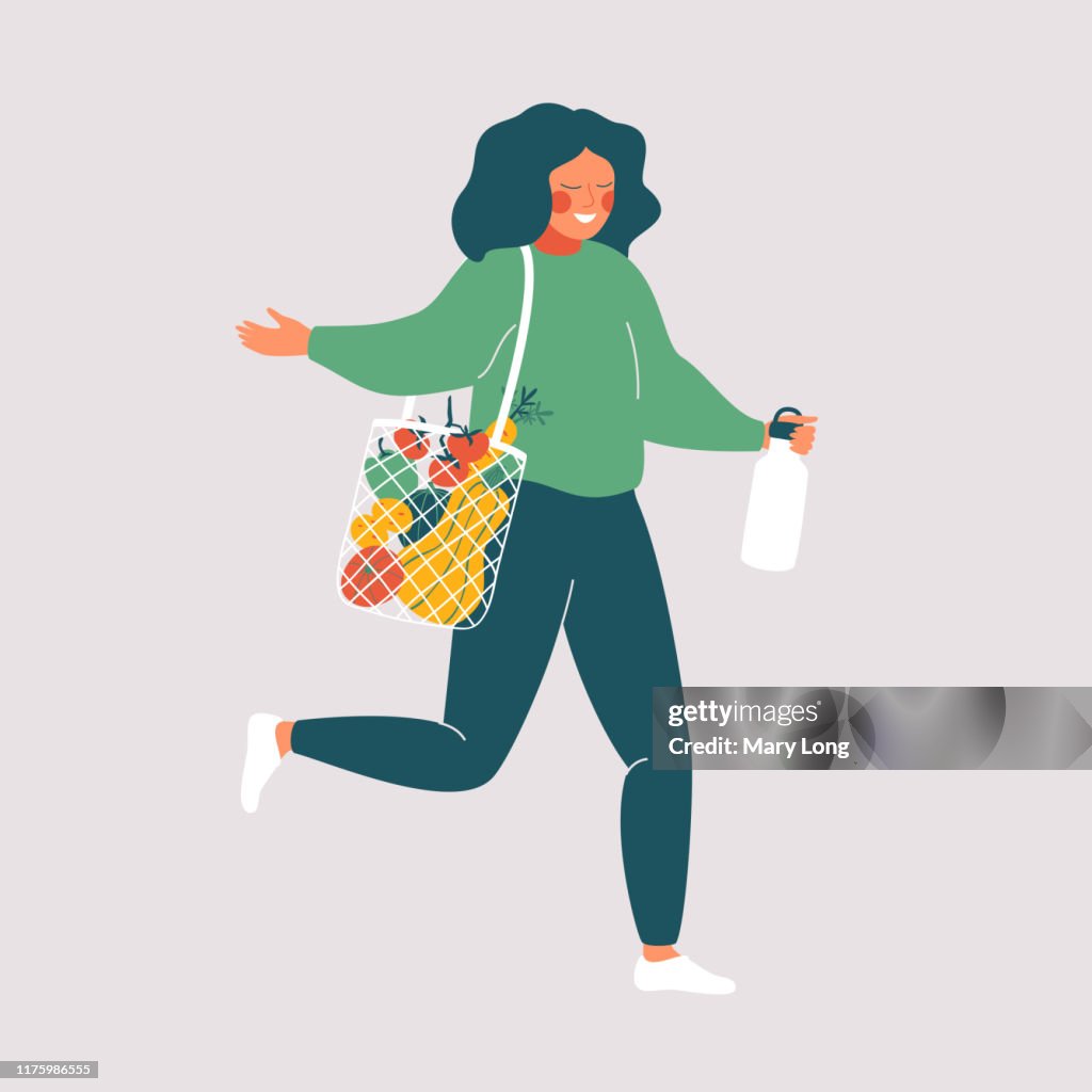 Woman holds reusable cup and eco bag with fresh food