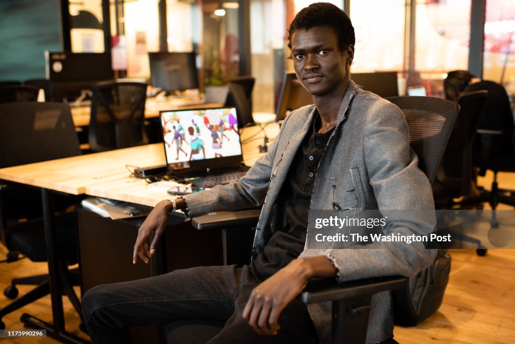 Sudanese refugee, Lual Mayen, 24, has turned his experience into a video game titled Salaam which will be released in December. He is pictured at his WeWork office in Washington, DC.