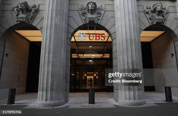 Sign hangs above the entrance to the UBS Group AG headquarters in Zurich, Switzerland, on Monday, Oct. 14, 2019. The spying scandal roiling Credit...