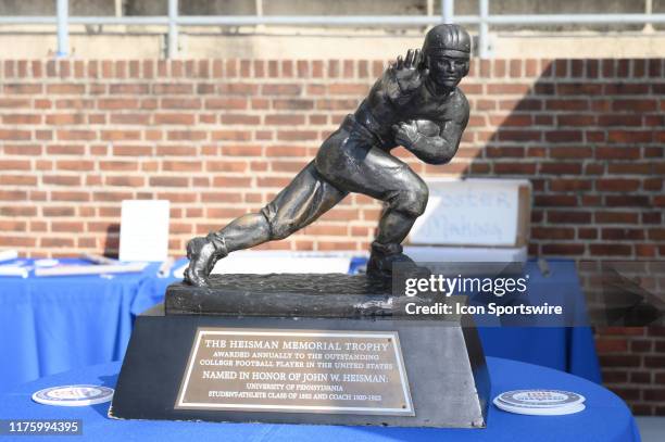 The Heisman trophy sits on a table during the game between the Sacred Heart Pioneers and the Penn Quakers on October 12, 2019 at Franklin Field in...