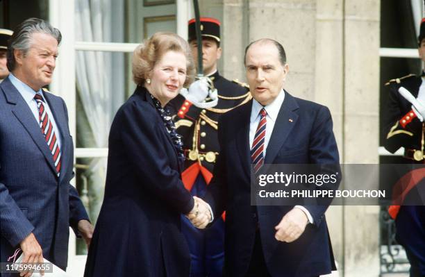 French Président François Mitterrand and Foreign Minister Roland Dumas welcome British Prime Minister Margaret Thatcher , 04 May 1984, in front of...