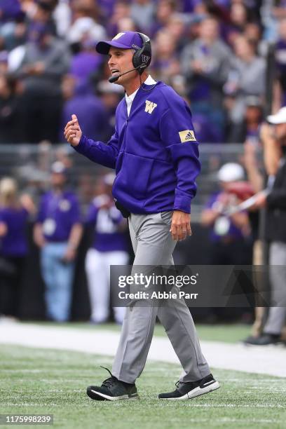 Head Coach Chris Petersen of the Washington Huskies reacts against the Hawaii Rainbow Warriors in the first quarter during their game at Husky...