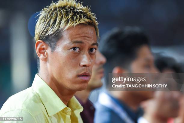 Cambodia's national football team manager Keisuke Honda looks on during the 2022 World Cup Asian zone 2nd round qualifying football match between...