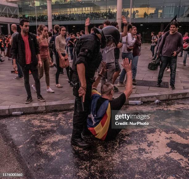 Demonstrators clash with police during a protest against the jailing of Catalan separatists at El Prat airport in Barcelona, Spain, on Monday, Oct....