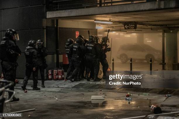 Demonstrators clash with police during a protest against the jailing of Catalan separatists at El Prat airport in Barcelona, Spain, on Monday, Oct....