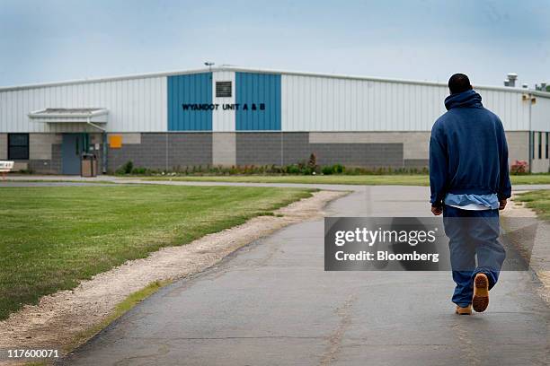 An inmate walks through the yard at the North Central Correctional Institution in Marion, Ohio, U.S., on Wednessday, June 15, 2011. As Ohio tries to...