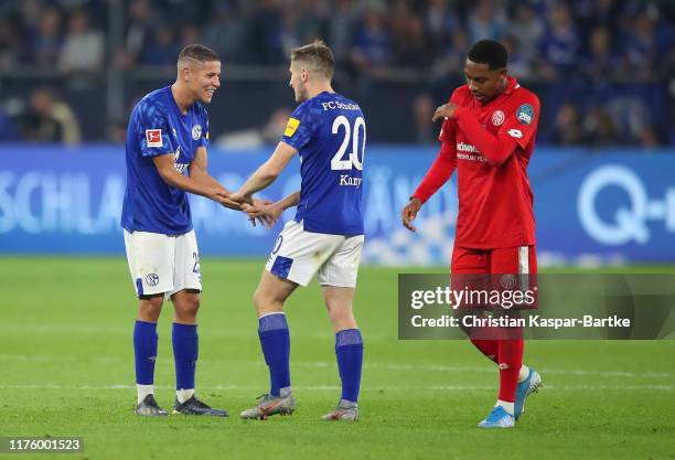 Amine Harit and Jonjoe Kenny of FC Schalke 04 celebrate victory after the Bundesliga match between FC Schalke 04 and 1. FSV Mainz 05 at Veltins-Arena...