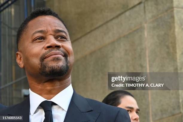 Oscar-winning actor Cuba Gooding Jr. Looks up as he departs his court arraignment in New York on October 15 where new charges are to be unsealed on...