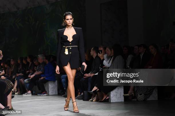 Kaia Gerber walks the runway at the Versace show during the Milan
