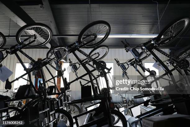 Pedal-powered products made by Coaster Cycles are stacked at the company's manufacturing facility inside a former lumber mill's 120-year-old shipping...