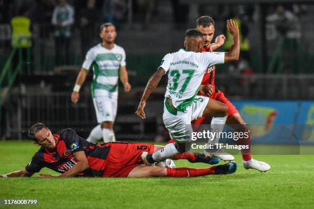 Benedikt Roecker of SV Wehen Wiesbaden and Julian Green of SpVgg Greuther Fuerth battle for the ball during the Second Bundesliga match between SpVgg...