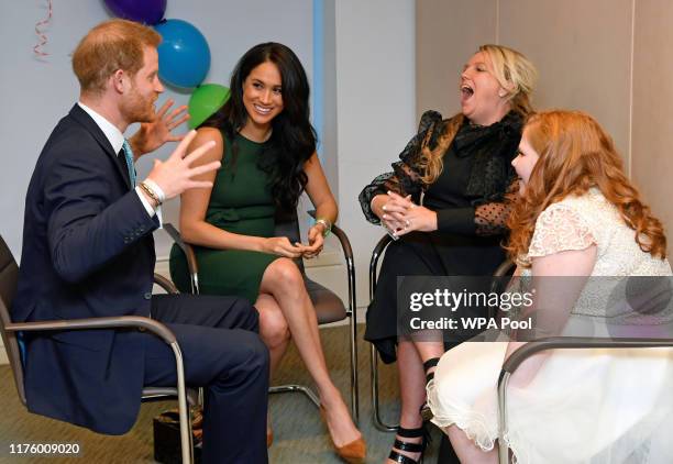 Prince Harry, Duke of Sussex and Meghan, Duchess of Sussex talk with Milky Sutherland and her mother Angela as they attend the WellChild awards...