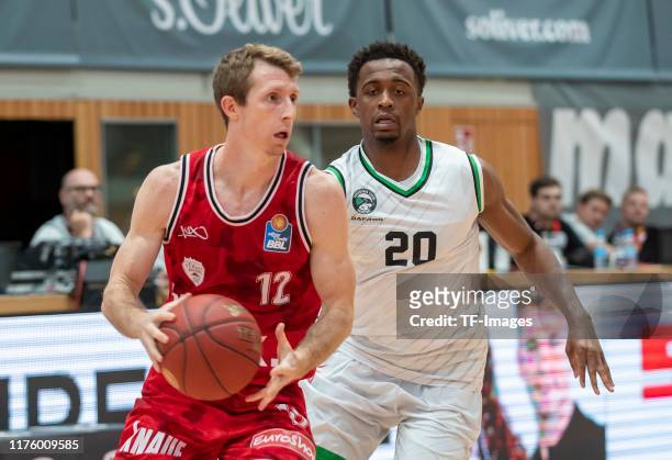 Skyler Bowlin of s.Oliver Wuerzburg and Doron Lamb of Darussafaka Istanbul battle for the ball during the test match between s.Oliver Wuerzburg and...