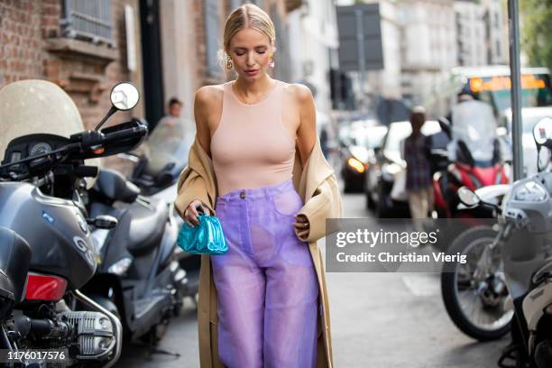 Leonie Hanne seen wearing body, Bottega Veneta metallic mini pouch, pink sheer pants outside the Blumarine show during Milan Fashion Week...