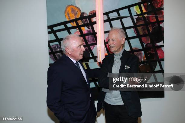 Artist Martial Raysse and Francois Pinault pose in front of a Martial Work "Noon Mediterranean Landscape" during the Kering Heritage Days opening...