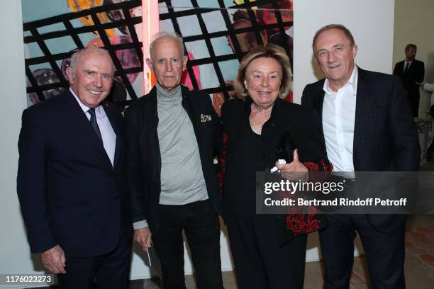 Francois Pinault, artist Martial Raysse and CEO of Kering Group, Maryvonne Pinault and Francois-Henri Pinault pose in front of a Martial Work "Noon...