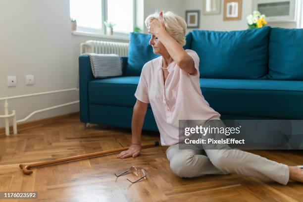 senior woman falling - fainting stock pictures, royalty-free photos & images