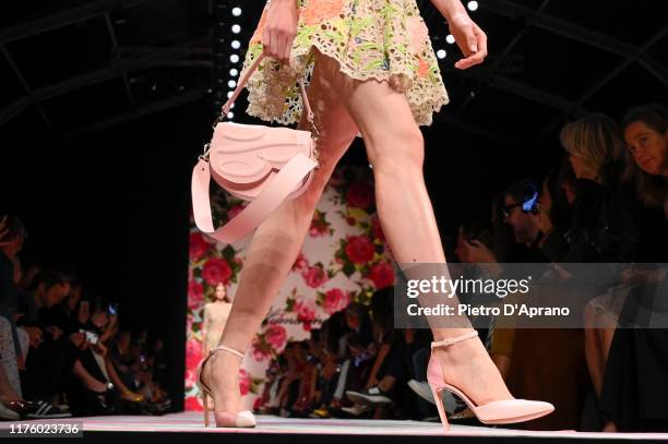 Model, shoe and bag detail, walks the runway at the Blumarine show during the Milan Fashion Week Spring/Summer 2020 on September 20, 2019 in Milan,...