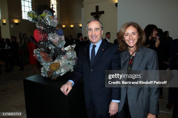Vice-President of Christies Europa Francois Curiel and Isabelle Bresset attend the Kering Heritage Days opening night at Kering and Balenciaga...