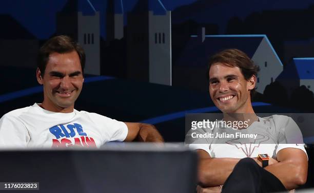Rafael Nadal of Team Europe and teammate Roger Federer share a joke during the singles match between Stefanos Tsitsipas of Team Europe and Taylor...