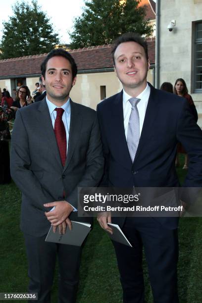 Alexandre Salat-Baroux and his brother Martin Rey-Chirac attend the Kering Heritage Days opening night at Kering and Balenciaga Company Headquarter...